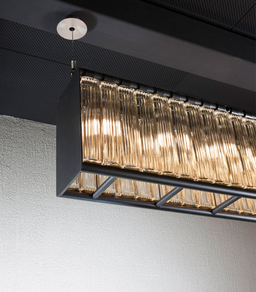 Santa & Cole Estadio Linear Pendant Light featured within interior space