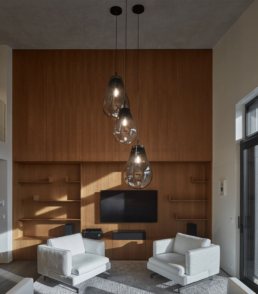 Bomma Tim Black Pendant Light hanging in a living room