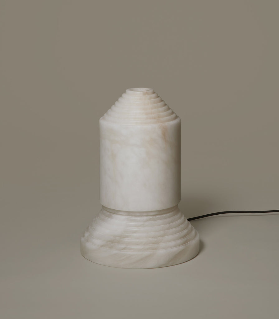 Santa & Cole Babel Alabaster Table Lamp featured within interior space