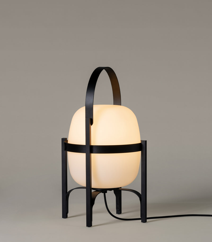 Santa & Cole Cesta Outdoor Table Lamp featured within outdoor space