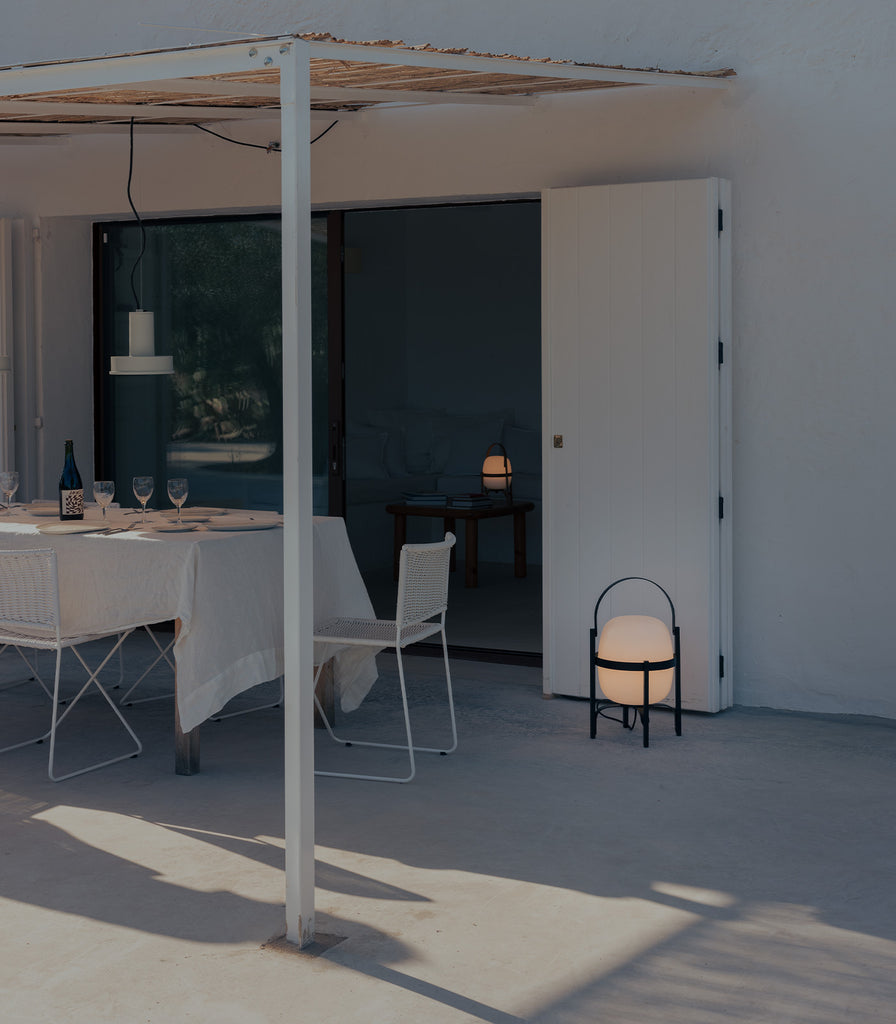 Santa & Cole Cesta Outdoor Table Lamp featured within outdoor space