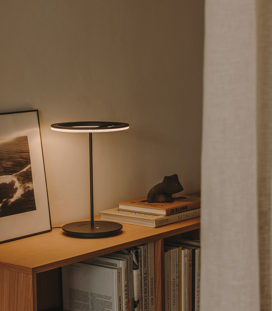 Santa & Cole Sin Table Lamp featured within interior space