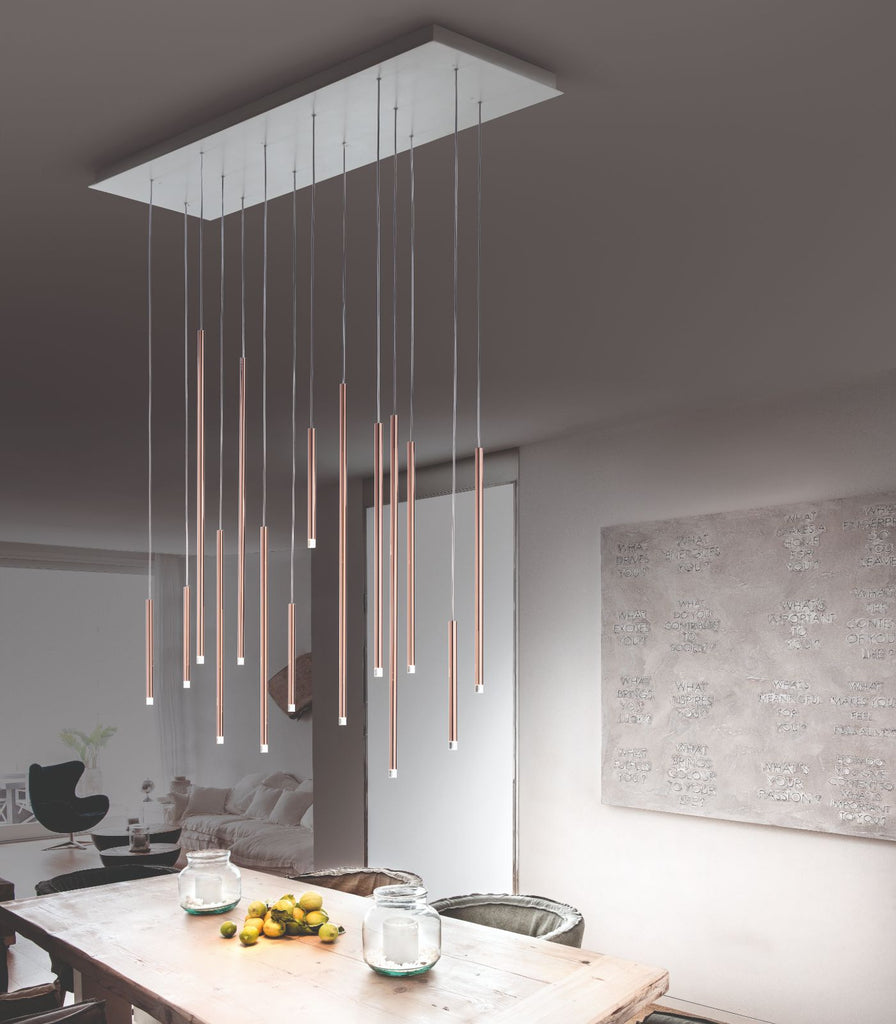 Lodes A-Tube Nano Pendant Light hanging over dining table