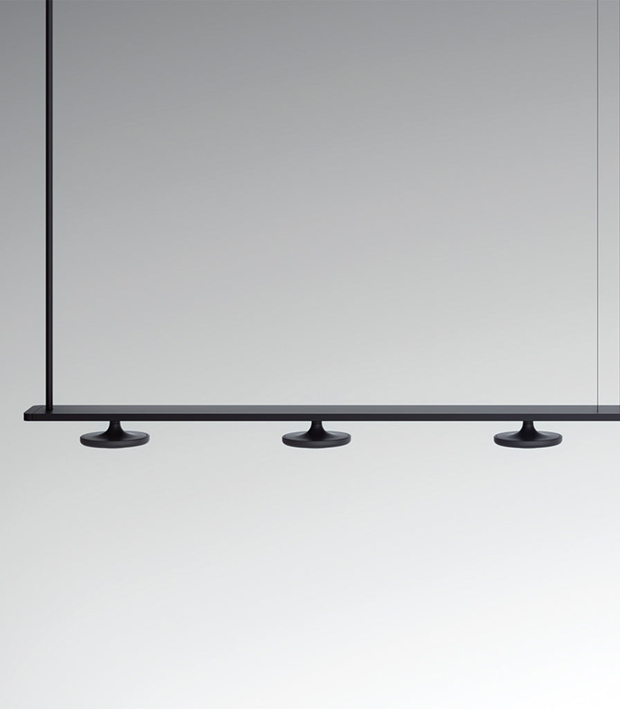 Estiluz Button 5lt Linear Pendant Light featured within interior space