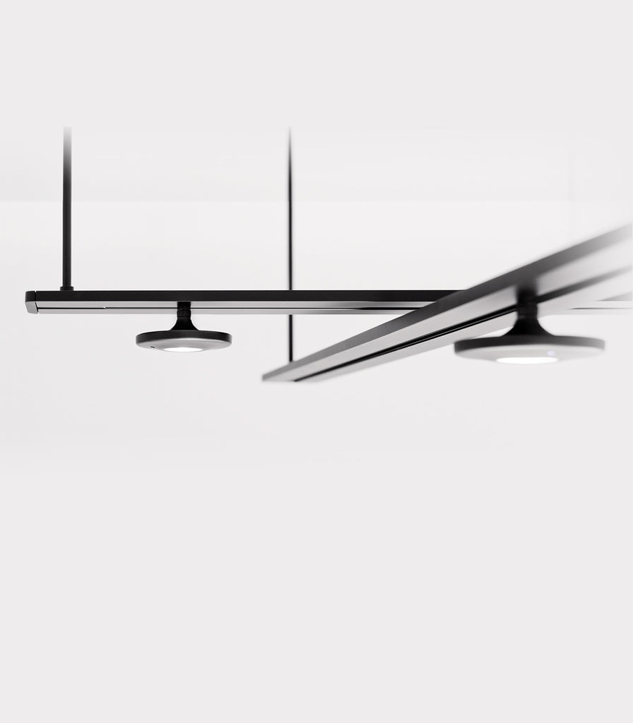 Estiluz Button 5lt Linear Pendant Light featured within interior space