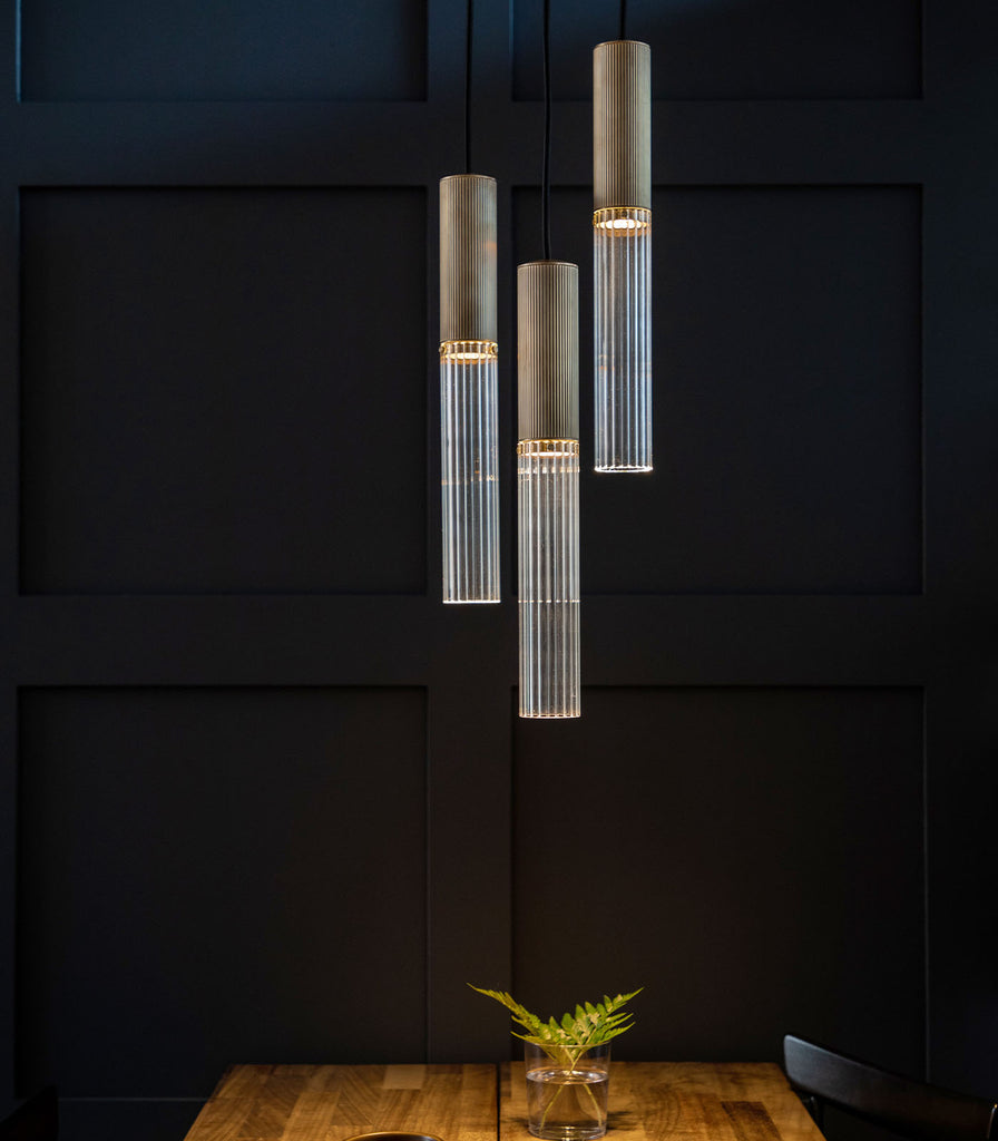 J. Adams & Co. Flume 3lt Pendant Light hanging over dining table