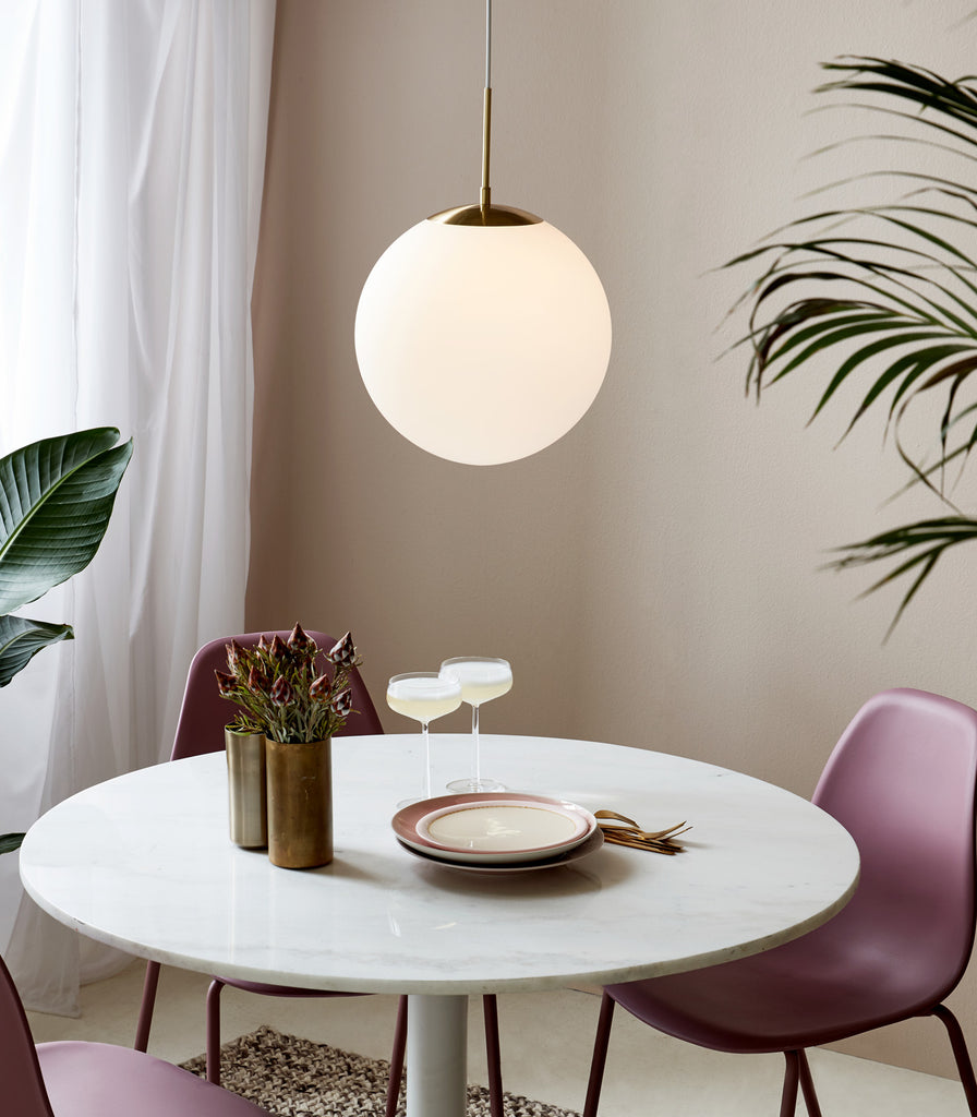 Nordlux Grant Pendant Light hanging over dining table