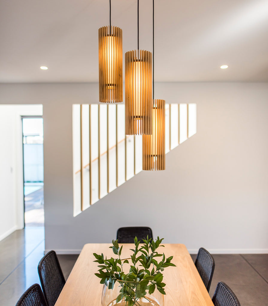 Maker Design Studio iO long pendant light cluster in interior space