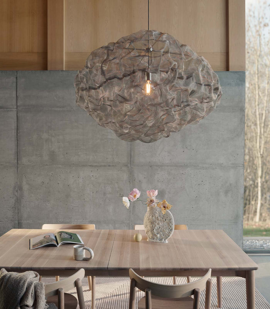 Northern Heat XL Pendant Light hanging over a dining table