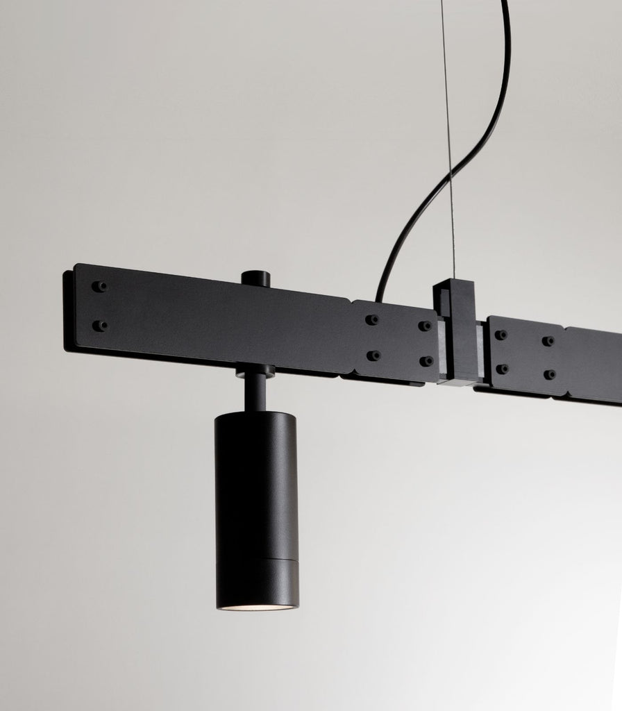 Karman Stant Linear Pendant Light featured within a interior space