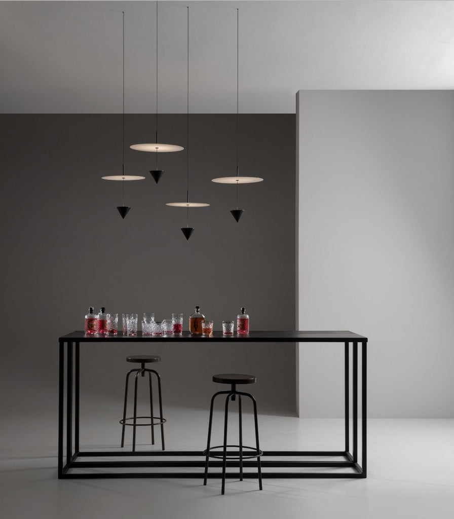 Karman Stralunata Pendant Light hanging above bar