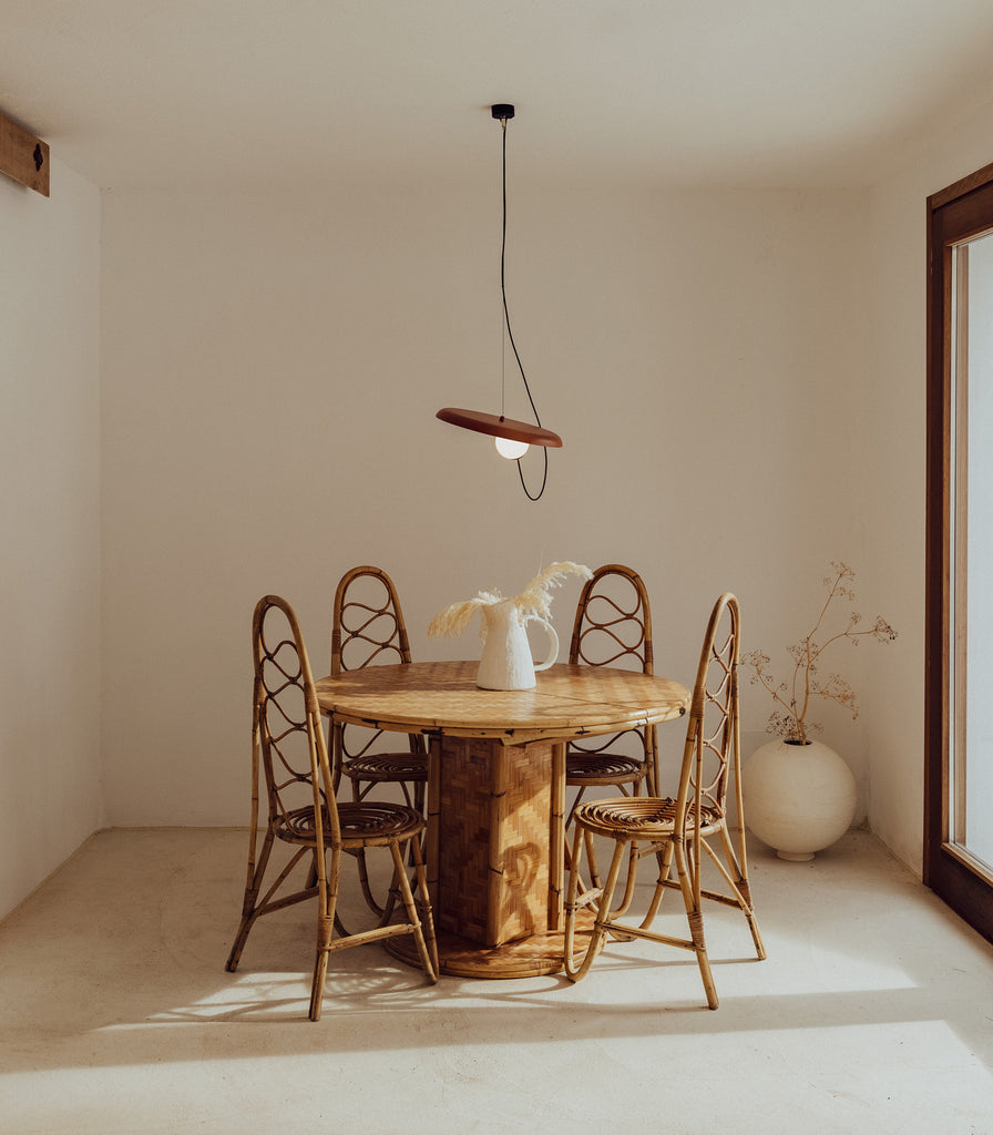 Milan Wire 38 Pendant Light hanging over dining table